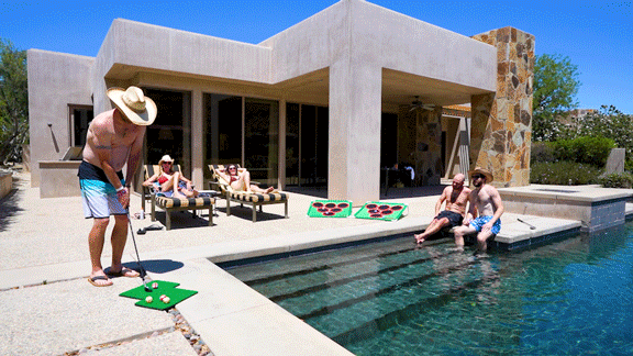 Golf Pong hero shot over a pool with friends