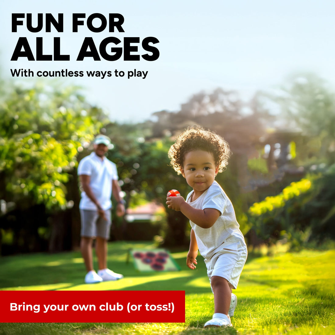 Toddler carrying a red foam ball across the lawn while playing the Golf Pong backyard golf game with dad